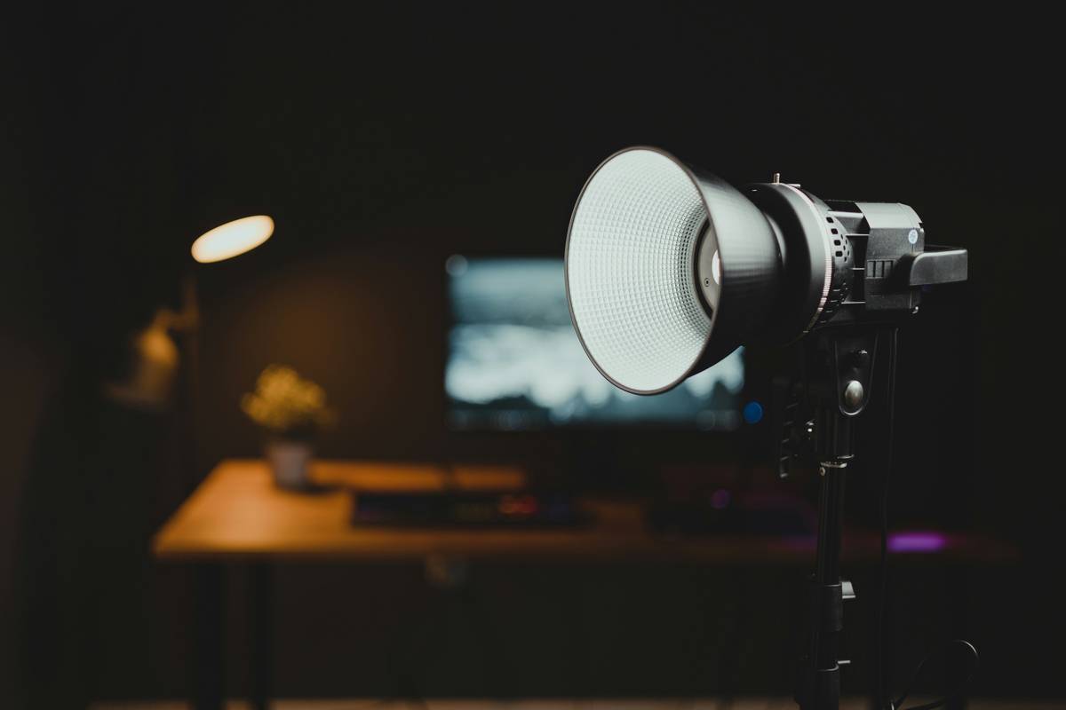 Streamer adjusting video equipment light how to change position with softbox setup